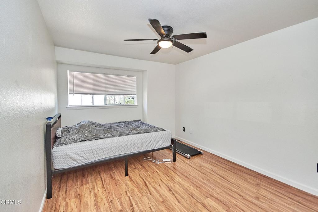 9527 Riggins Road Phelan, CA 92371 - Photo 13 of 49 a bedroom with a bed and window