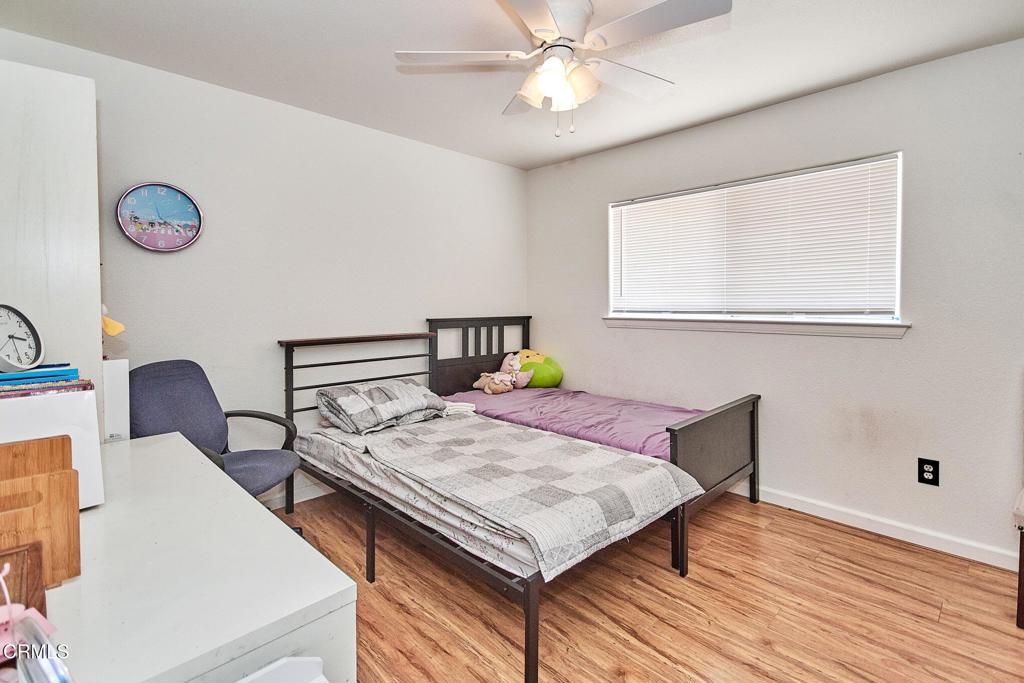 9527 Riggins Road Phelan, CA 92371 - Photo 20 of 49 a bedroom with a bed and a table in it