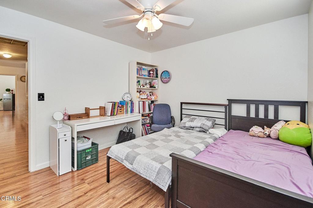 9527 Riggins Road Phelan, CA 92371 - Photo 21 of 49 a bedroom with a bed and a table