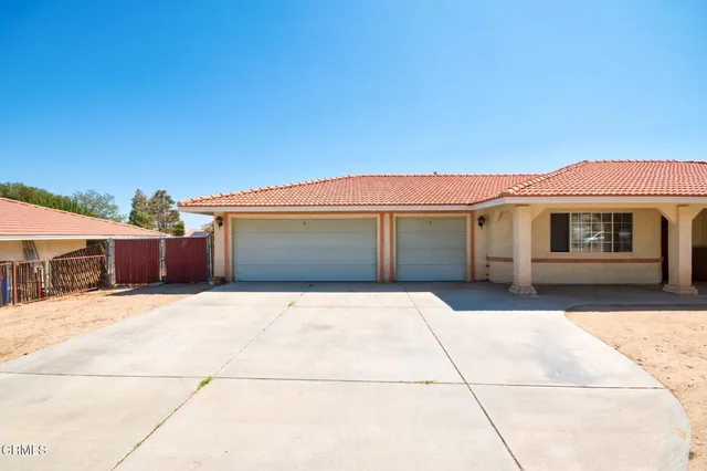 a front view of a house with a garage
