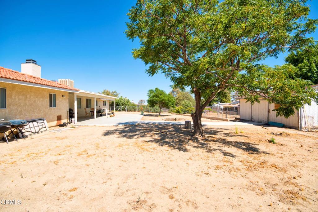 9527 Riggins Road Phelan, CA 92371 - Photo 44 of 49 a view of a dirt road and a building