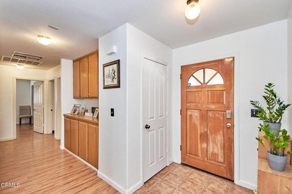 9527 Riggins Road Phelan, CA 92371 - Photo 5 of 49 a view of a hallway view with wooden floor and staircase