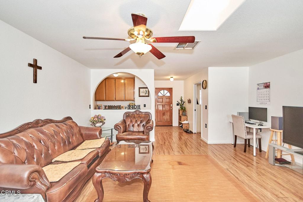 9527 Riggins Road Phelan, CA 92371 - Photo 8 of 49 a living room with furniture a ceiling fan and a window