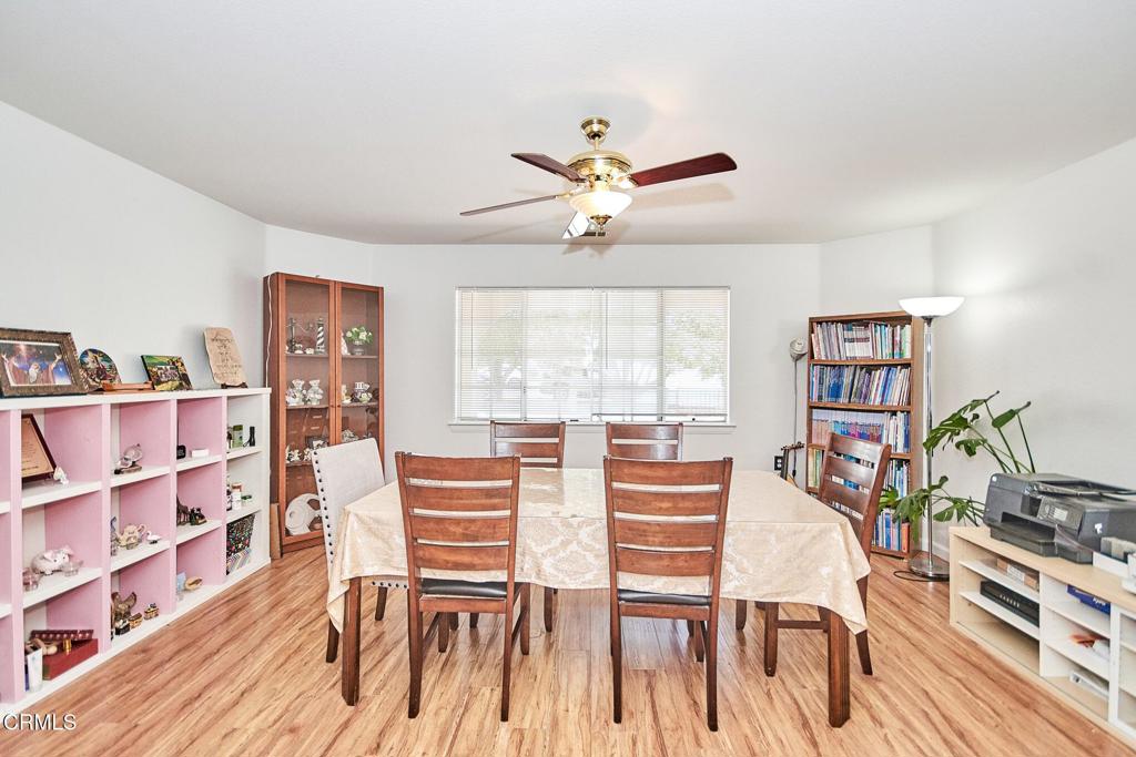 9527 Riggins Road Phelan, CA 92371 - Photo 10 of 49 a view of a livingroom with furniture and a book shelf