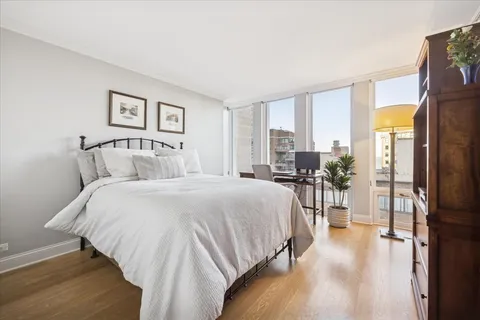 a bedroom with a large bed and a table