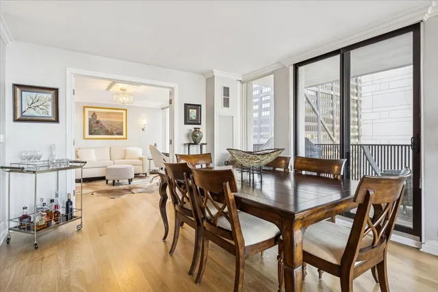 a dining room with furniture and wooden floor