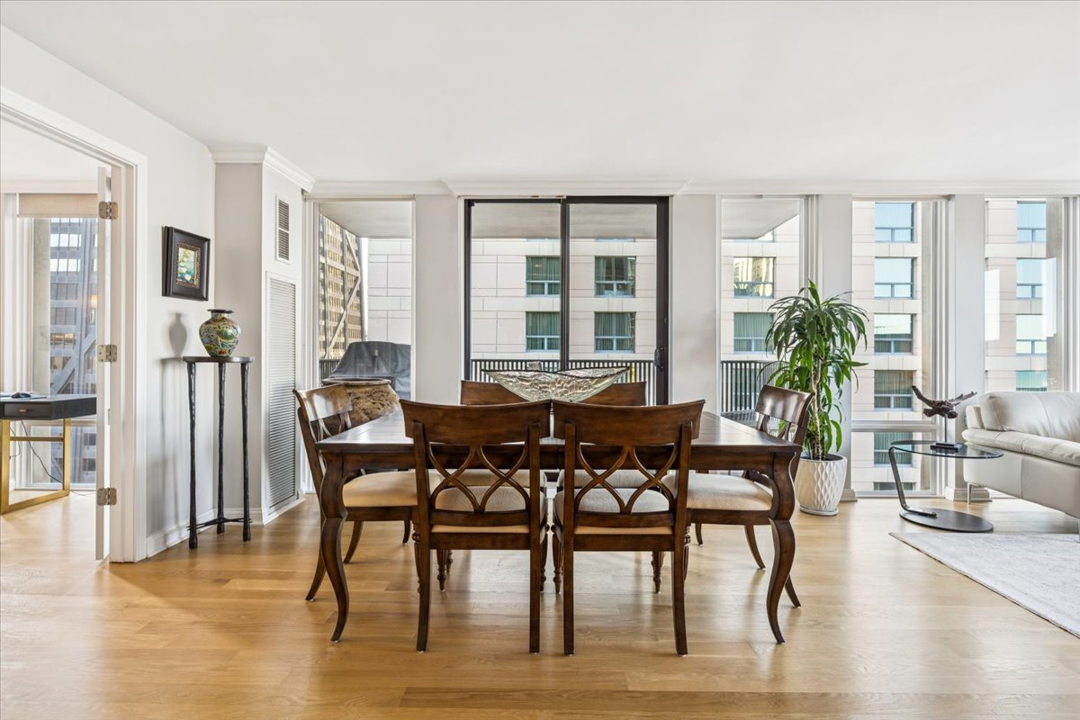 200 East Delaware Place, Unit 20A Chicago, IL 60611 - Photo 24 of 46 a view of a dining room with furniture window and wooden floor