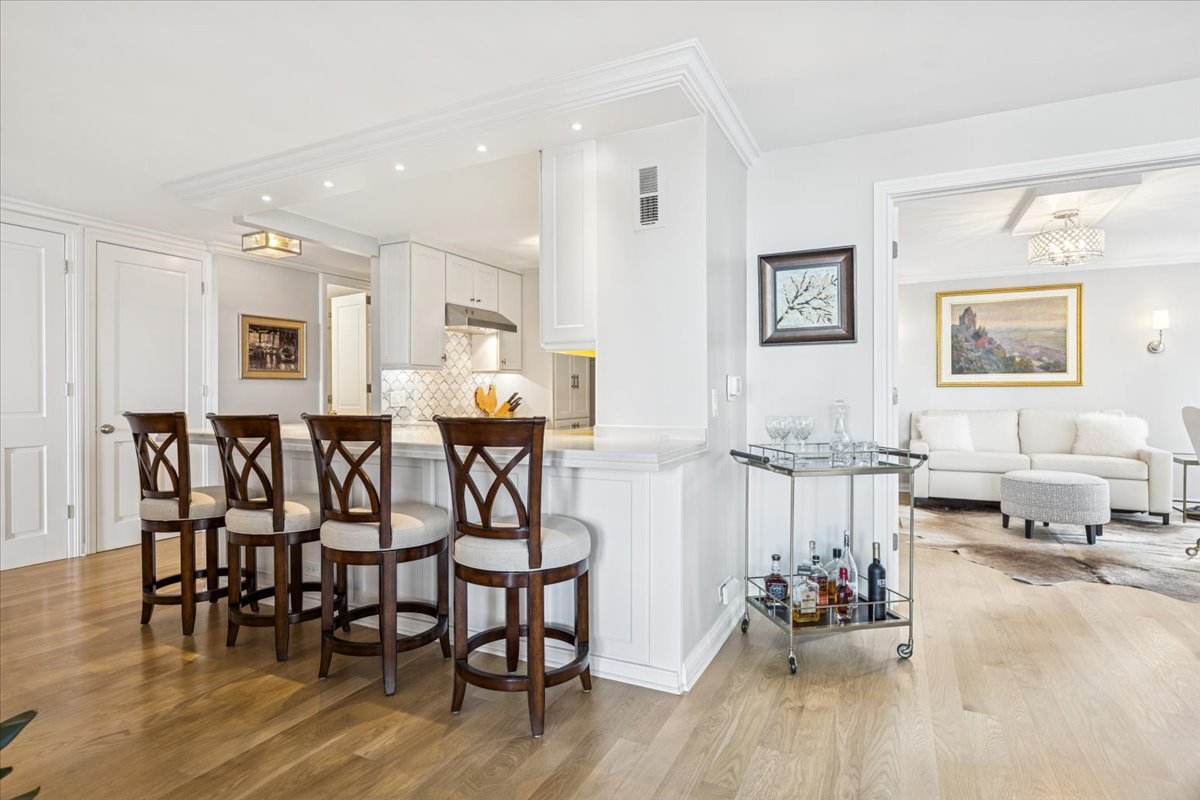 200 East Delaware Place, Unit 20A Chicago, IL 60611 - Photo 25 of 46 a very nice looking living room with furniture and wooden floor