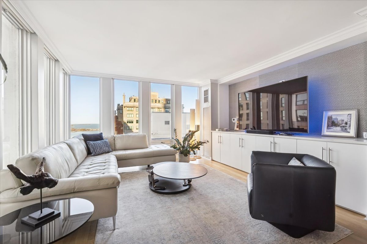200 East Delaware Place, Unit 20A Chicago, IL 60611 - Photo 31 of 46 a living room with furniture and a large window