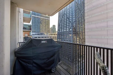 a view of balcony and wooden floor