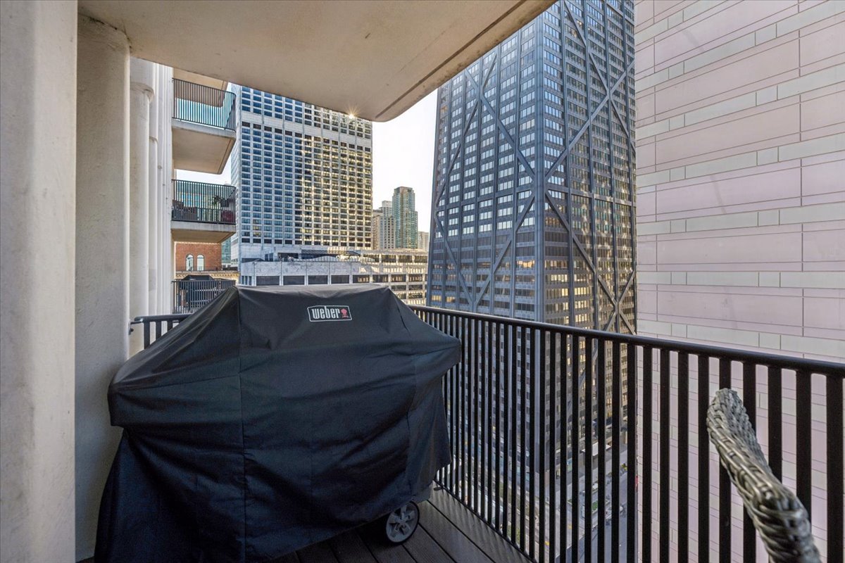 200 East Delaware Place, Unit 20A Chicago, IL 60611 - Photo 35 of 46 a view of balcony and wooden floor