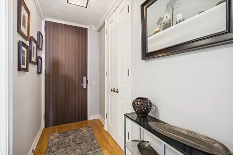 a view of a hallway to rooms