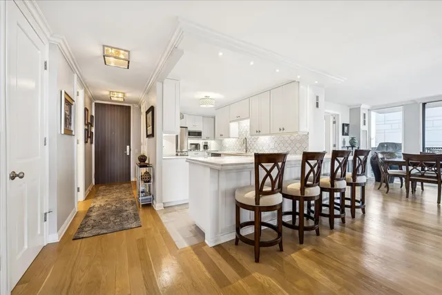 a large kitchen with a table and chairs