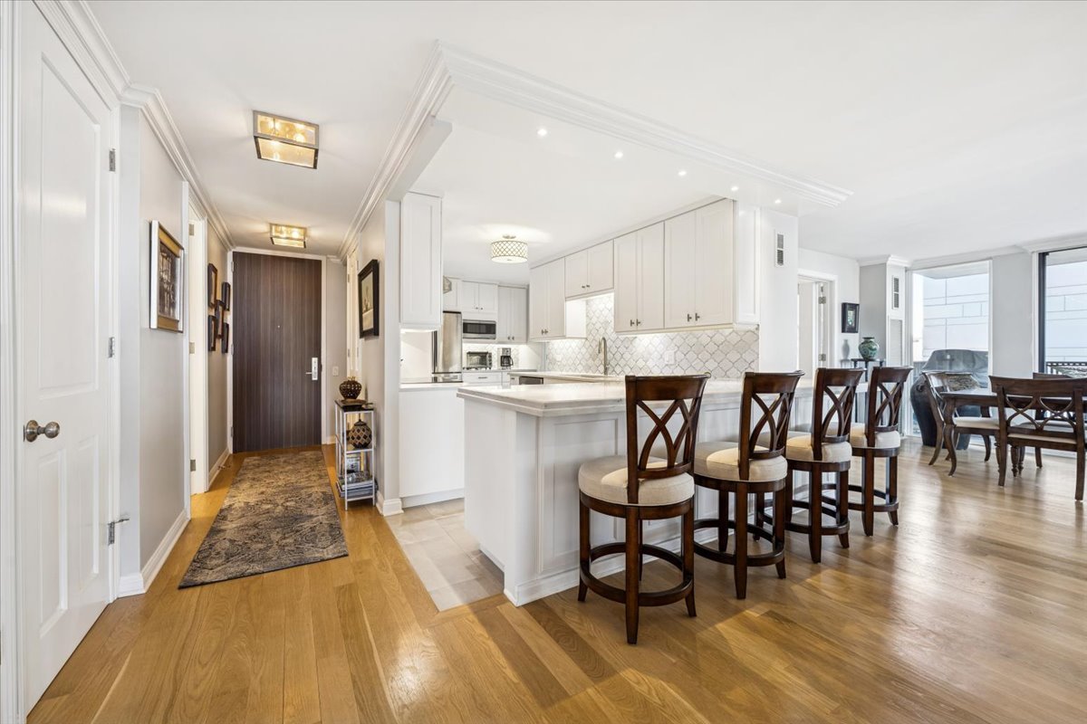 200 East Delaware Place, Unit 20A Chicago, IL 60611 - Photo 8 of 46 a large kitchen with a table and chairs