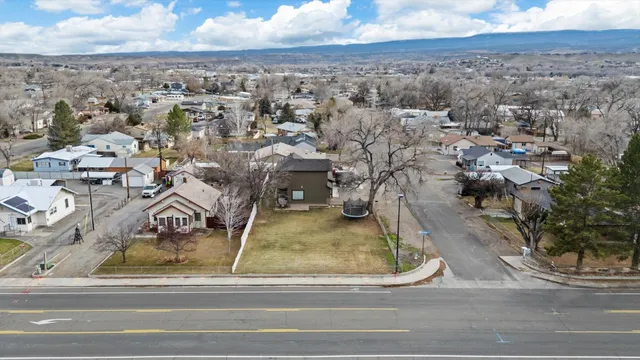 an aerial view of residential houses with outdoor space