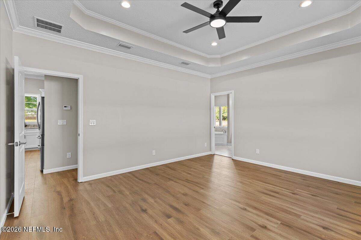 2462 Viola Street Middleburg, FL 32068 - Photo 16 of 61 wooden floor in an empty room with a window