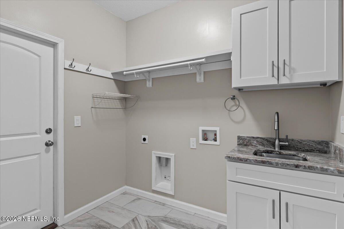 2462 Viola Street Middleburg, FL 32068 - Photo 33 of 61 a kitchen with a sink and cabinets