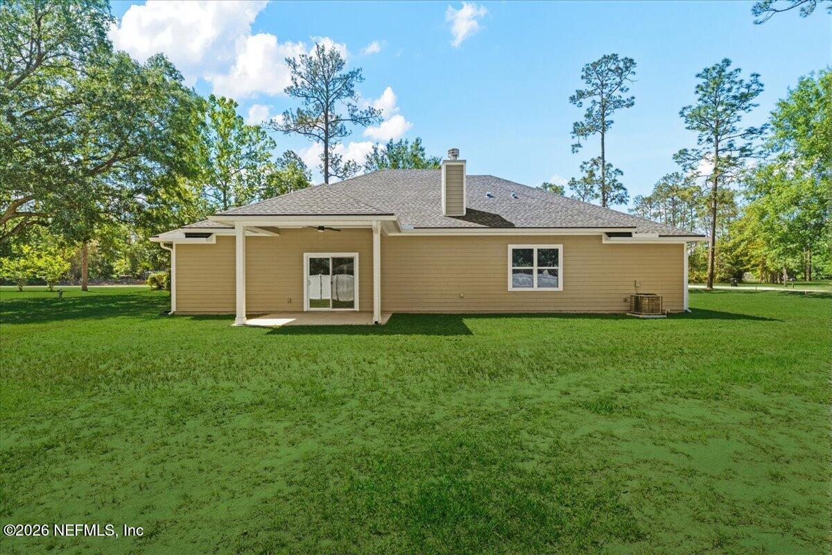 2462 Viola Street Middleburg, FL 32068 - Photo 38 of 61 a view of a house with a garden