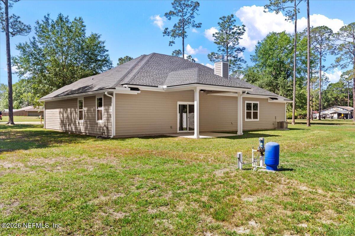 2462 Viola Street Middleburg, FL 32068 - Photo 39 of 61 a view of a house with a yard