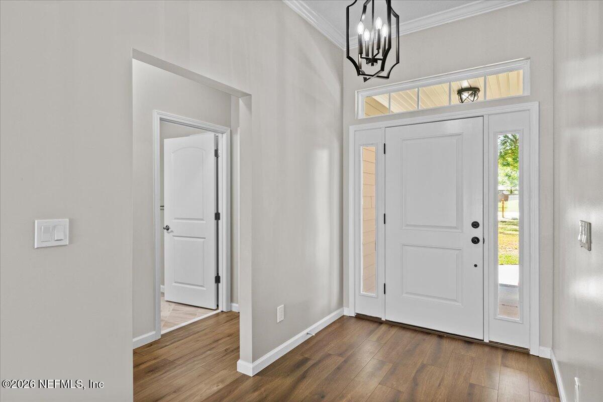 2462 Viola Street Middleburg, FL 32068 - Photo 5 of 61 a view of an entryway with wooden floor