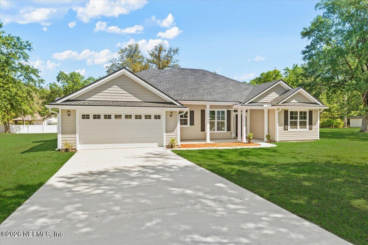 2462 Viola Street Middleburg, FL 32068 - Photo 57 of 61 a front view of a house with a yard