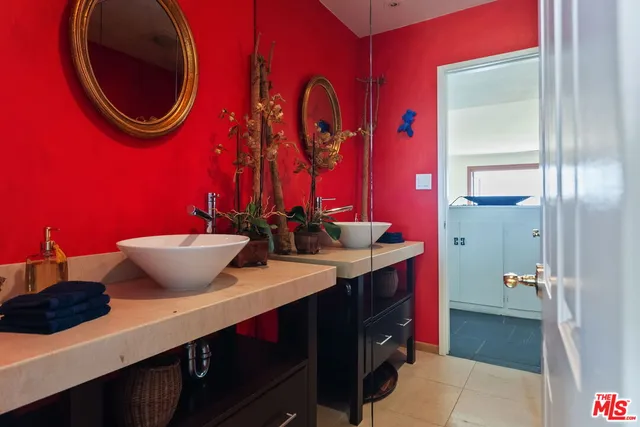 a view of a room with a large window and wooden floor