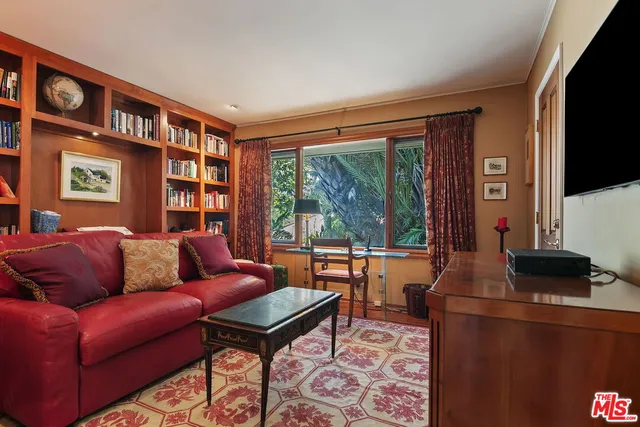 a spacious bathroom with a double vanity sink a large mirror and a bathtub