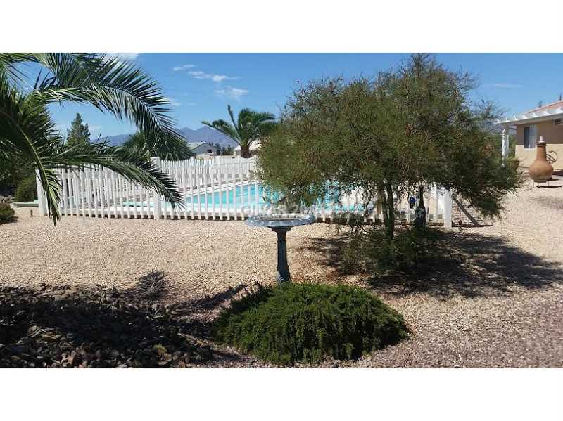 3201 South Rodeo Avenue Pahrump, NV 89048 - Photo 24 of 33 Exterior Back. Beautiful yard and pool area.