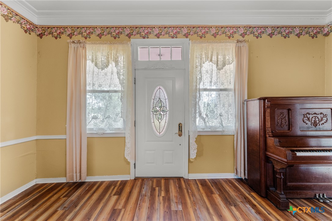 2967 South Old Robinson Road Lorena, TX 76655 - Photo 21 of 41 a view of a hallway with wooden floor and a window