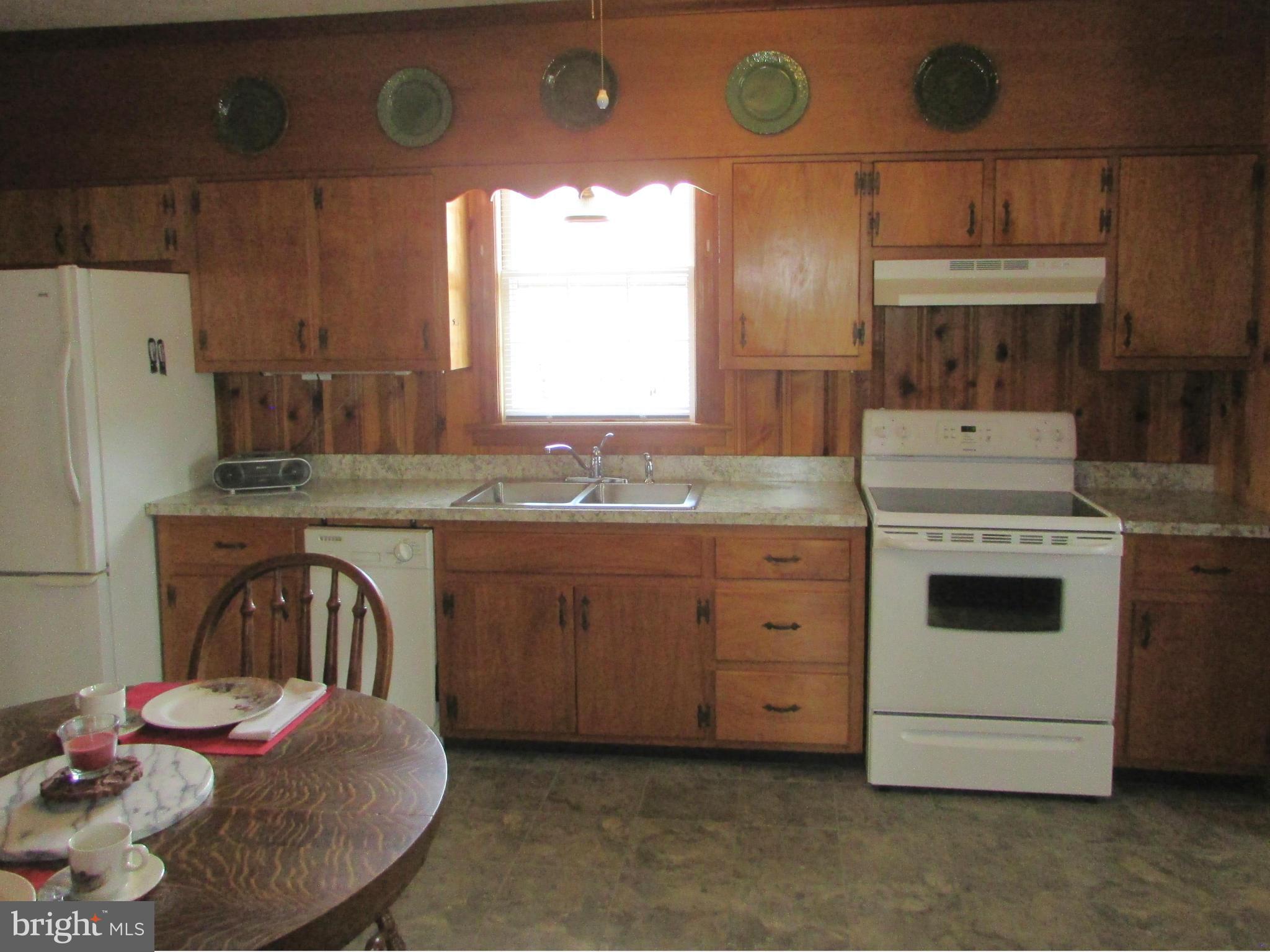 3344 Emory Road North Finksburg, MD 21048 - Photo 14 of 30 a kitchen with a stove a sink and a refrigerator