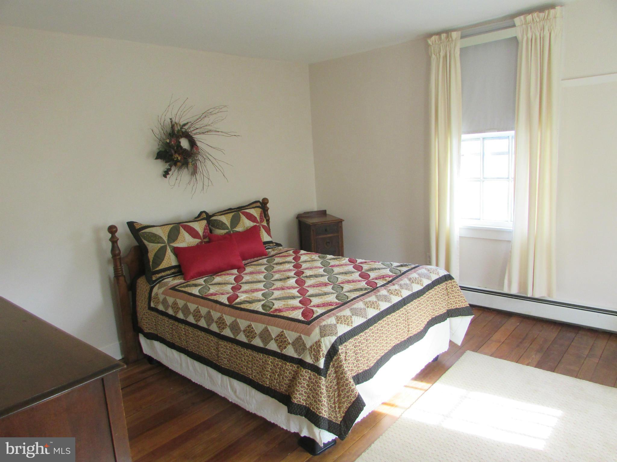 3344 Emory Road North Finksburg, MD 21048 - Photo 20 of 30 a bed sitting in a bedroom next to a window