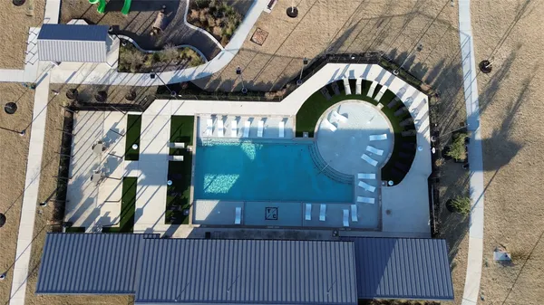 an aerial view of a house with a swimming pool