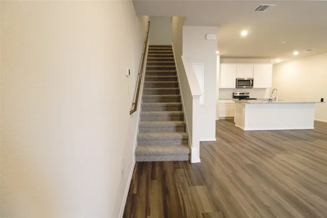 a view of kitchen and wooden floor