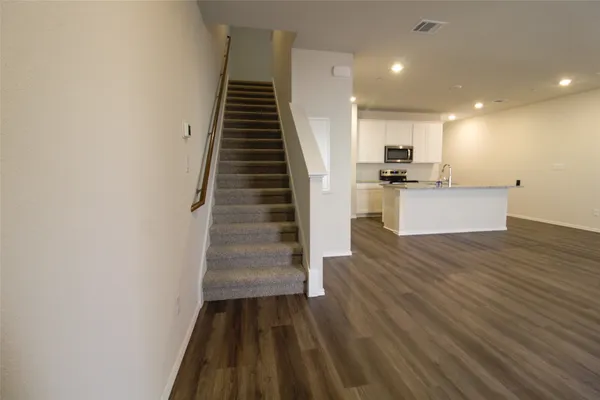 a view of kitchen and wooden floor