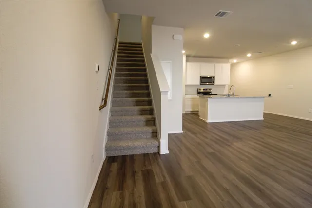 a view of kitchen and wooden floor