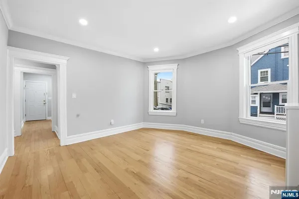 a view of livingroom with hardwood floor and hallway