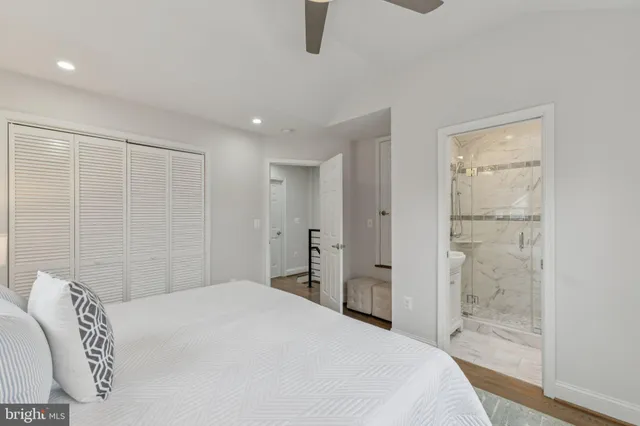 a bedroom with a bed and a shower