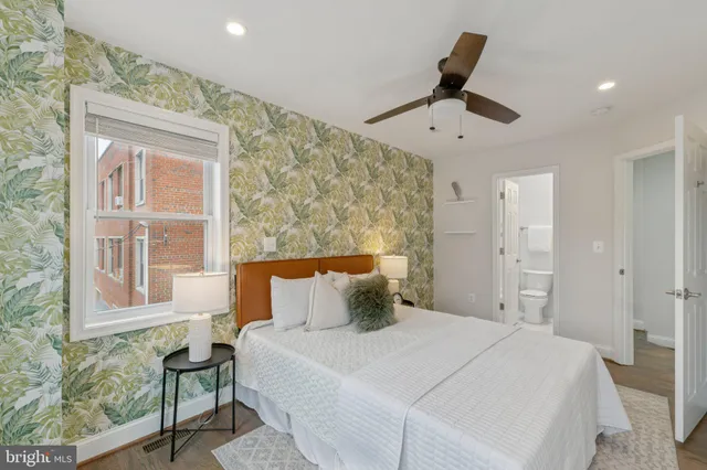 a bedroom with a bed and a window