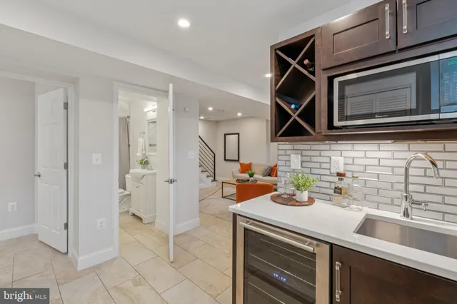 a kitchen with a sink and a microwave