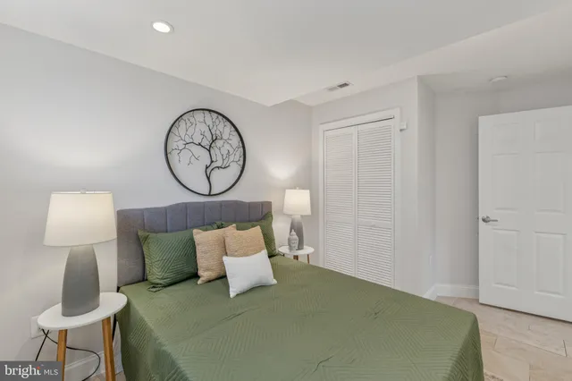 a bed room with a bed and a chair