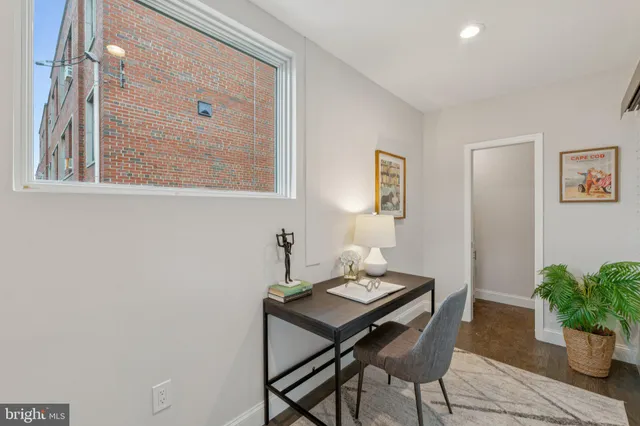 a view of a workspace with furniture