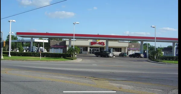 a view of a food mall next to a road