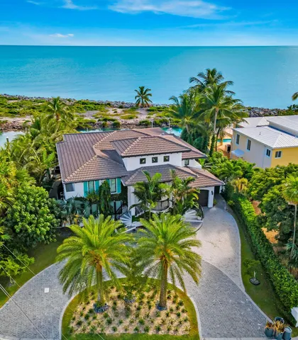 a view of a dining room with furniture wooden floor and chandelier