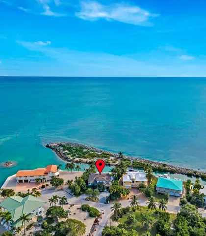 a view of a dining room with furniture and window
