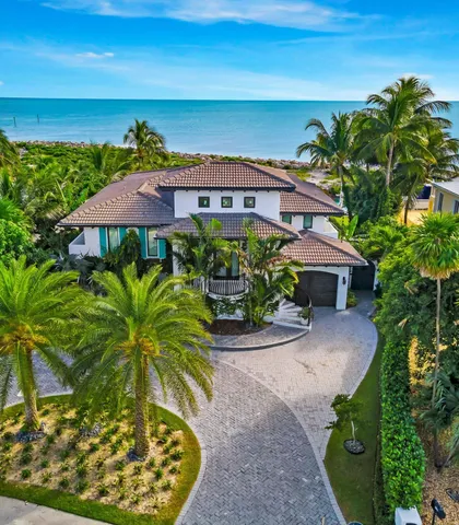 a view of a swimming pool with a table and chairs