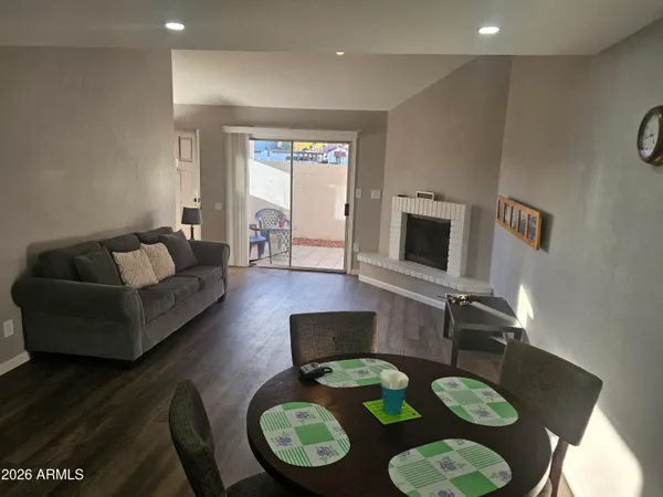 a living room with furniture and a fireplace