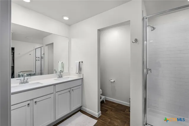 a bedroom with a bed and a lamp