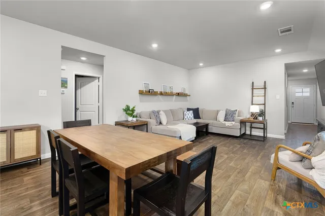 a kitchen with a sink stove and refrigerator