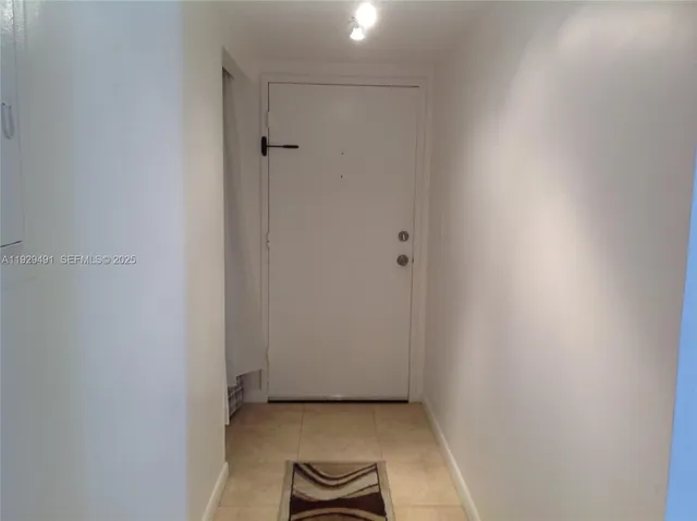 a living room with furniture rug and a window