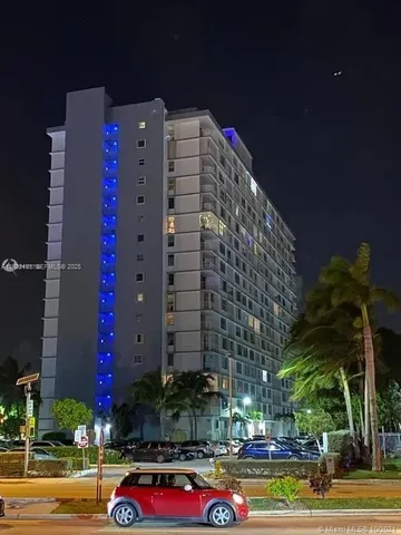 a view of a swimming pool with a yard